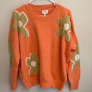 BiBi Orange Tangerine Spring Sweater with Green Floral Design Size Medium.